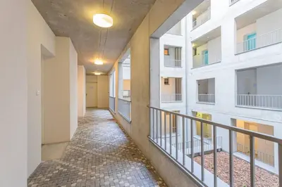 a corridor of an apartment building with a hallway at 12 min Centrum, 200Mb WIFI, Onsite Supermarket in Prague