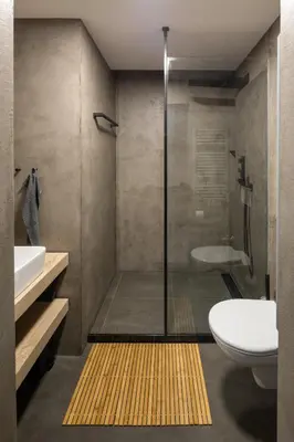 a bathroom with a shower and a toilet and a sink at Ocean Breeze Apartment in Prague