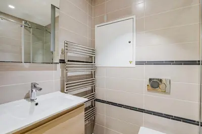 a bathroom with a sink and a mirror at Blueground Prague 1 furnished Old town square PRG-43 in Prague