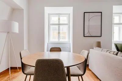 a dining room with a table and chairs at Blueground Prague 1 furnished Old town square PRG-43 in Prague