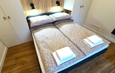 an overhead view of a bed in a small room at Short Way Apartments in Prague