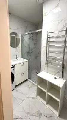 a bathroom with a shower and a sink at Short Way Apartments in Prague