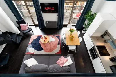 an overhead view of a living room with a couch and a table at Modern loft-apartments in Prague in Prague