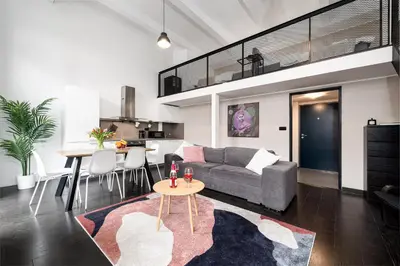 a living room with a couch and a table at Modern loft-apartments in Prague in Prague