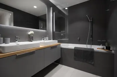 a black bathroom with two sinks and a bath tub at Viktoria Suite N3 with Garage & Balcony in Prague