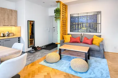 a living room with a couch and a table at Apartmán Flora in Prague