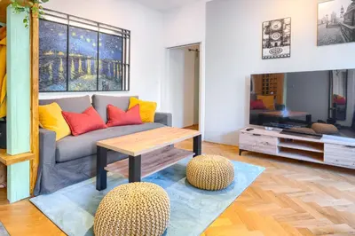 a living room with a couch and a table at Apartmán Flora in Prague
