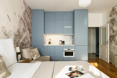 a bedroom with a bed and colorful furniture at National Museum Apartment Prague in Prague