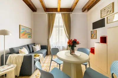 a living room with a chair and a fireplace at National Museum Apartment Prague in Prague