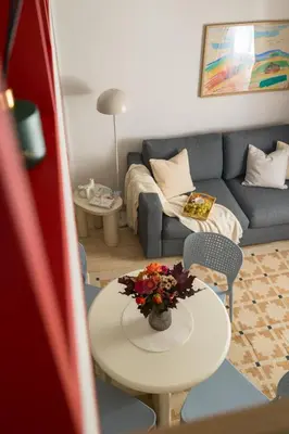 a living room with a table and a couch at National Museum Apartment Prague in Prague