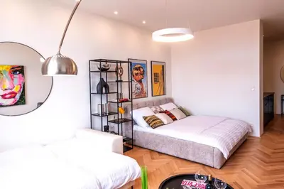a bedroom with two beds in a room at Sunny & Quiet studio in peaceful hood,metro access in Prague