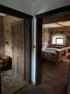 an open door to a bedroom with a bed at Ekologická farma Skřivaň in Skřivaň