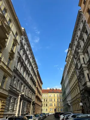 two tall buildings next to each other on a street at Tyrsova Apartment City Centre in Prague