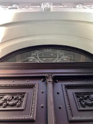 a brown door with a window above it at Apartment with a terrace and AC in the city center in Prague