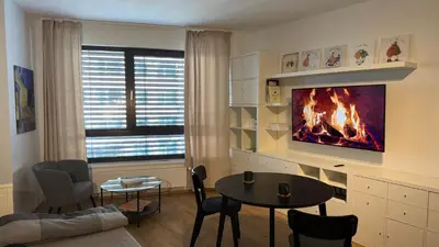 a kitchen with green cabinets and a sink at NEW STYLISH APARTMENT Varta Alpha 2025 & Parking in Prague