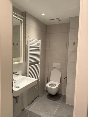 a bathroom with a toilet and a sink at NEW STYLISH APARTMENT Varta Alpha 2025 & Parking in Prague