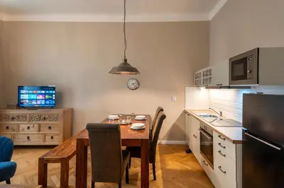 a kitchen with a table and a dining room at 1 Bed Flat - Sleeps 5 - Parking - Wifi in Prague