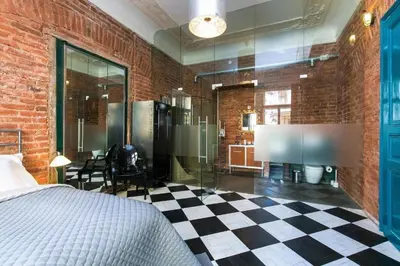 a bedroom with a bed and a checkered floor at 2 Bed Flat - Sleeps 3 - Wifi in Prague