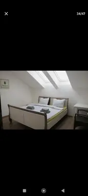 a bedroom with a bed with a skylight at Urban, 2 Bedroom, six min tram Charles bridge in Prague