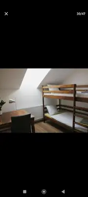 a bedroom with a desk and a bunk bed with a desk at Urban, 2 Bedroom, six min tram Charles bridge in Prague
