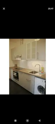 a kitchen with a sink and a counter top at Urban, 2 Bedroom, six min tram Charles bridge in Prague