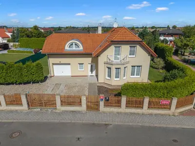 a house with an orange roof and a fence at Villa Garden & Terrace Villa by Interhome in Prague