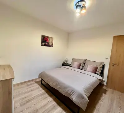 a living room with a couch and a table at Tomaš Apartment,Free Parking-02 Arena in Prague