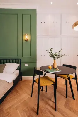 a bedroom with a table and a bed and a bed and a table and chair at Luxury Design Apartment at Old Town Square with Air Condition in Prague