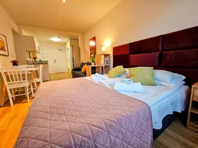 a bedroom with a large bed in a room at TERRACE-VIEW PRAGUE APARTMENTS for Business & Leisure, FREE PARKING & Gym, Near Metro & Aqua Sport Centre in Prague