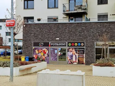 a store front of a brick building at LIVE-INN PRAGUE SUPERIOR SUITE FOR 1-4 GUESTS, 20 Mins to center, Lift, Gym, Reception, Parking, Roof Terrace, Game & Party Room in Prague