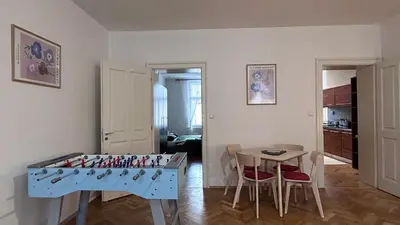 a living room with a table and a chess board at Stylish accommodation in the center of Prague in Prague