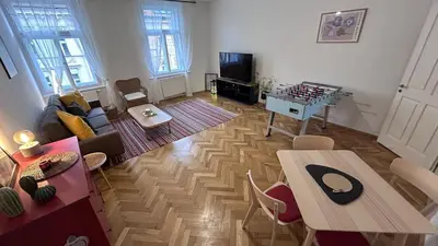 a living room with a couch and a table at Stylish accommodation in the center of Prague in Prague