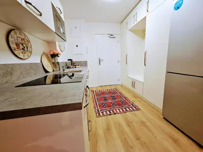 a kitchen with a sink and a refrigerator at TERRACE-VIEW 2BR PRAGUE APARTMENTS for Business & Leisure, FREE PARKING & Gym, Near Metro & Aqua Sport Centre in Prague