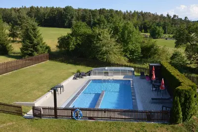 an overhead view of a swimming pool in a yard at Apartmány Kamejk in Kamýk nad Vltavou