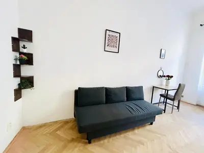 a living room with a couch and a table at Retro style in centrum Prague Andel in Prague