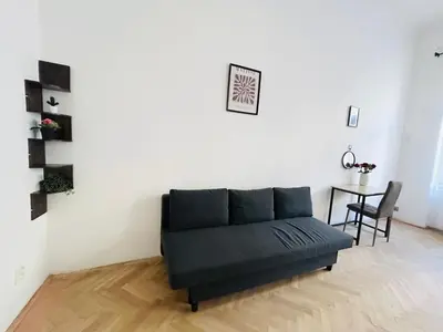 a living room with a couch and a table at Retro style in centrum Prague Andel in Prague