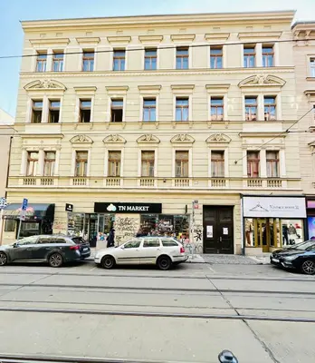 a large building with cars parked in front of it at Retro style in centrum Prague Andel in Prague
