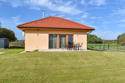 a small house with an orange roof at Chata U Bezedné in Velký Osek