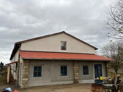 a house with a red roof at Nostalgická myš in Kokořín