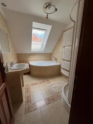 a large bathroom with a tub and a sink at Ubytování v Nalžovicích in Nalžovice