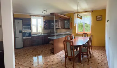 a kitchen with a table and chairs in a room at Ubytování v Nalžovicích in Nalžovice