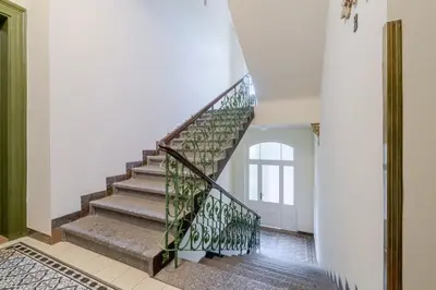 a staircase in a home with a stair case at Blueground Vinohrady close to Namesti Miru PRG-2 in Prague