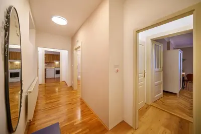 a hallway of a apartment with an open door at 3 Bed Flat - Sleeps 12 - Wifi in Prague
