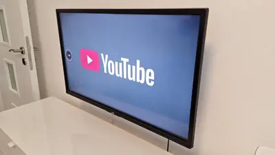 a television screen with the youtube logo on it at Pretty private Apartment U LABE, self-service check-in 24 l 7 in Neratovice