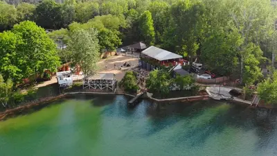 an aerial view of a house next to a lake at Pretty private Apartment U LABE, self-service check-in 24 l 7 in Neratovice