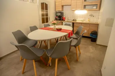 a dining room table and chairs in a kitchen at Grand apartment near Dancing House in Prague