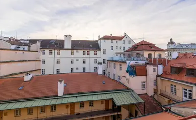 a group of buildings in a city with roofs at Prague Days - Old Town Apartments in TOP location in Prague