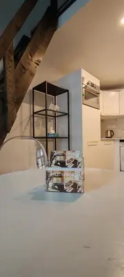 a kitchen with a shelf with dishes on it at Opletal Echoes in Prague