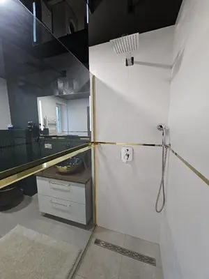 a kitchen with a white refrigerator in a room at Apartmán U Labe in Nymburk