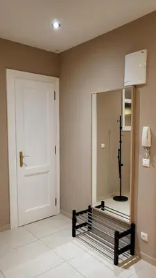 a room with a mirror and a white door and a mirror at Premium Apt - Center of Prague in Prague